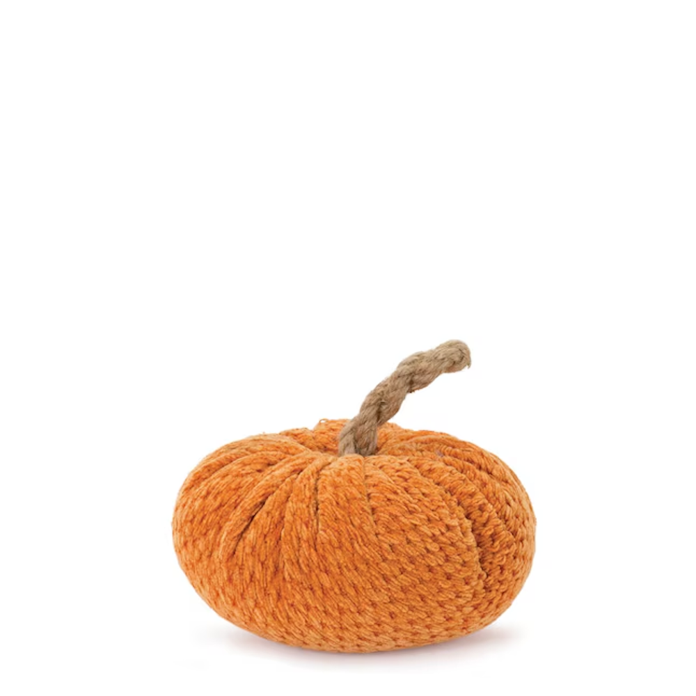 Small orange textured fabric pumpkin with a twisted twine stem on a plain white background.