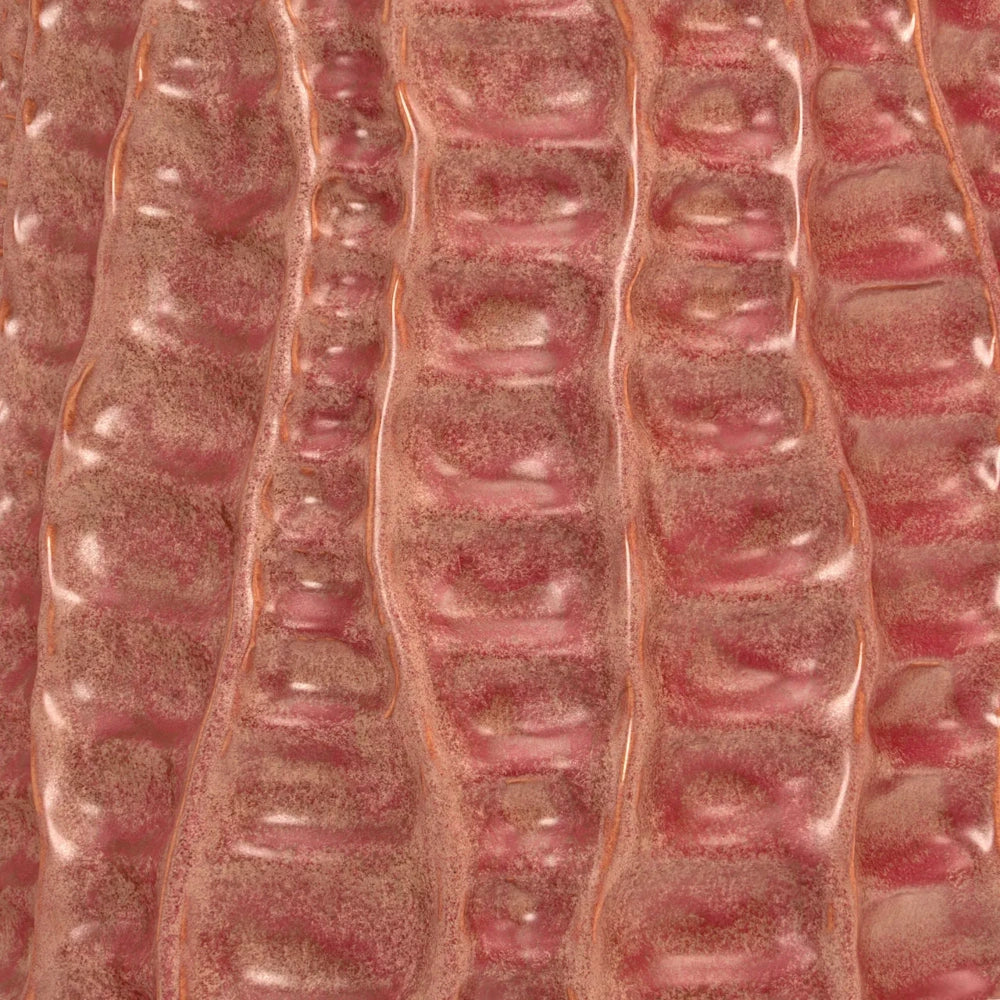 Close-up of a pinkish-brown textured ceramic surface with vertical, wavy ridges and a speckled glaze finish.