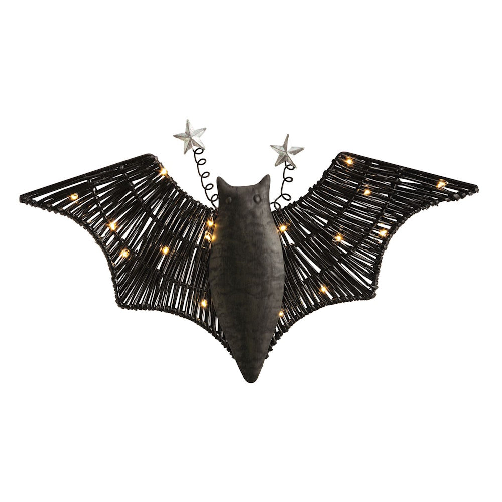 Black woven bat decoration with glowing lights on its wings and starry antenna.