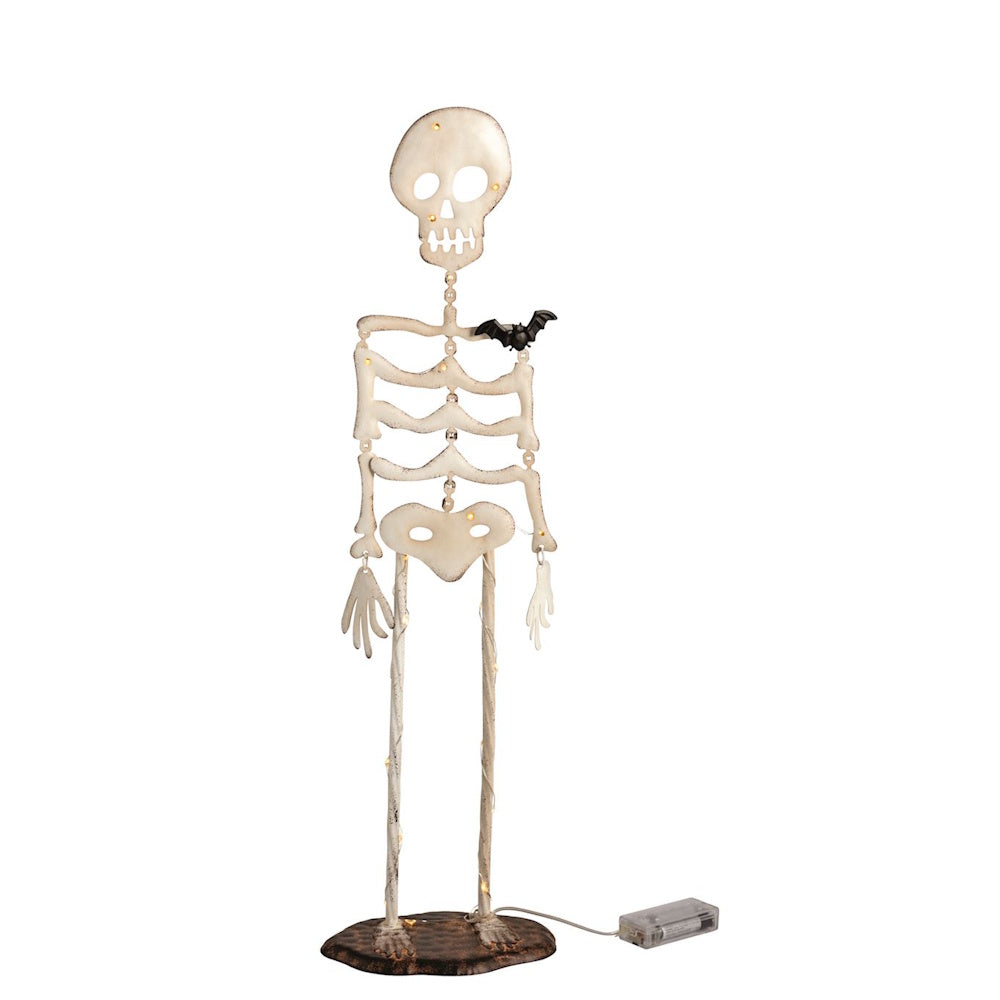A light-up skeleton figurine with a small black bat on its shoulder on a white background.