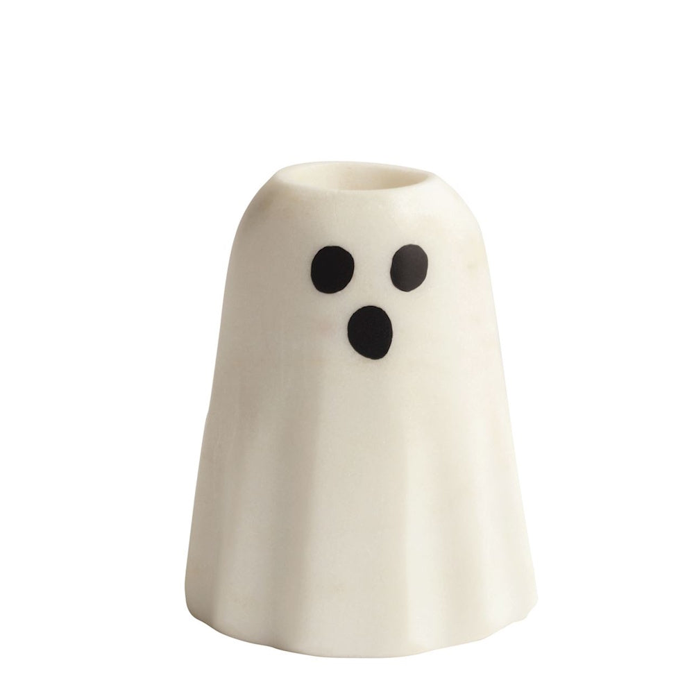 Small white marble ghost taper candle holder with black eyes and mouth on white background.