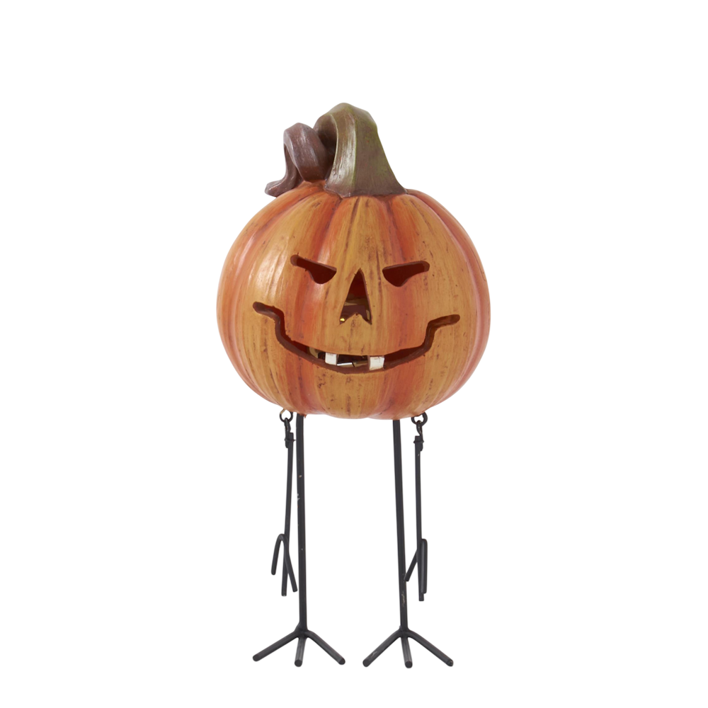 A smiling jack-o'-lantern decoration standing on long, thin metal bird legs against a white background.