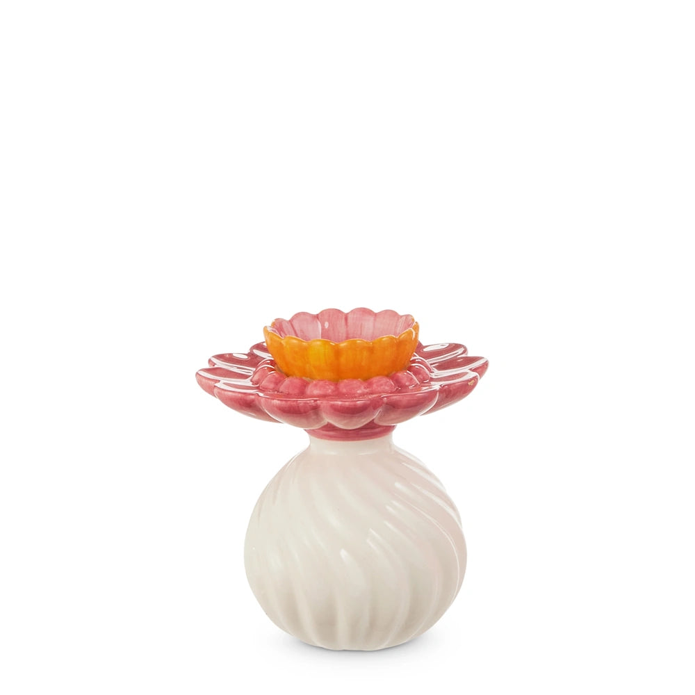 Small ruffled whimsy bud vase with a white swirled base and pink and orange floral-shaped top on a white background.