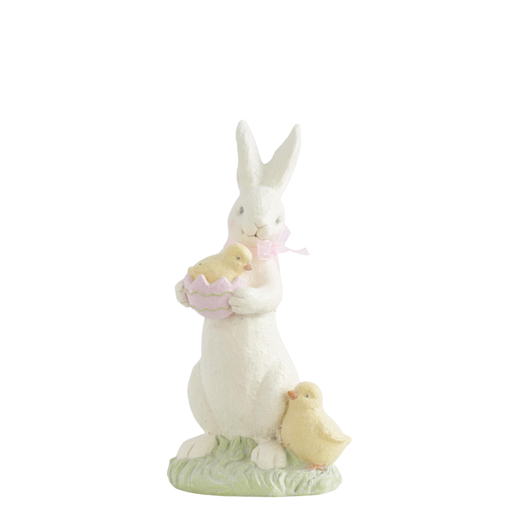 White resin Easter bunny figurine holding a chick in a pink egg shell, featuring a second yellow chick at its feet.