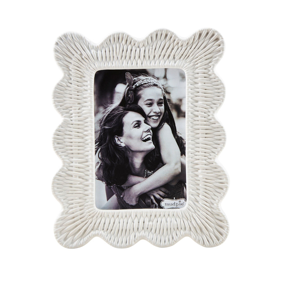 White stoneware picture frame with a wavy scalloped edge and textured wicker-inspired pattern on a white background.