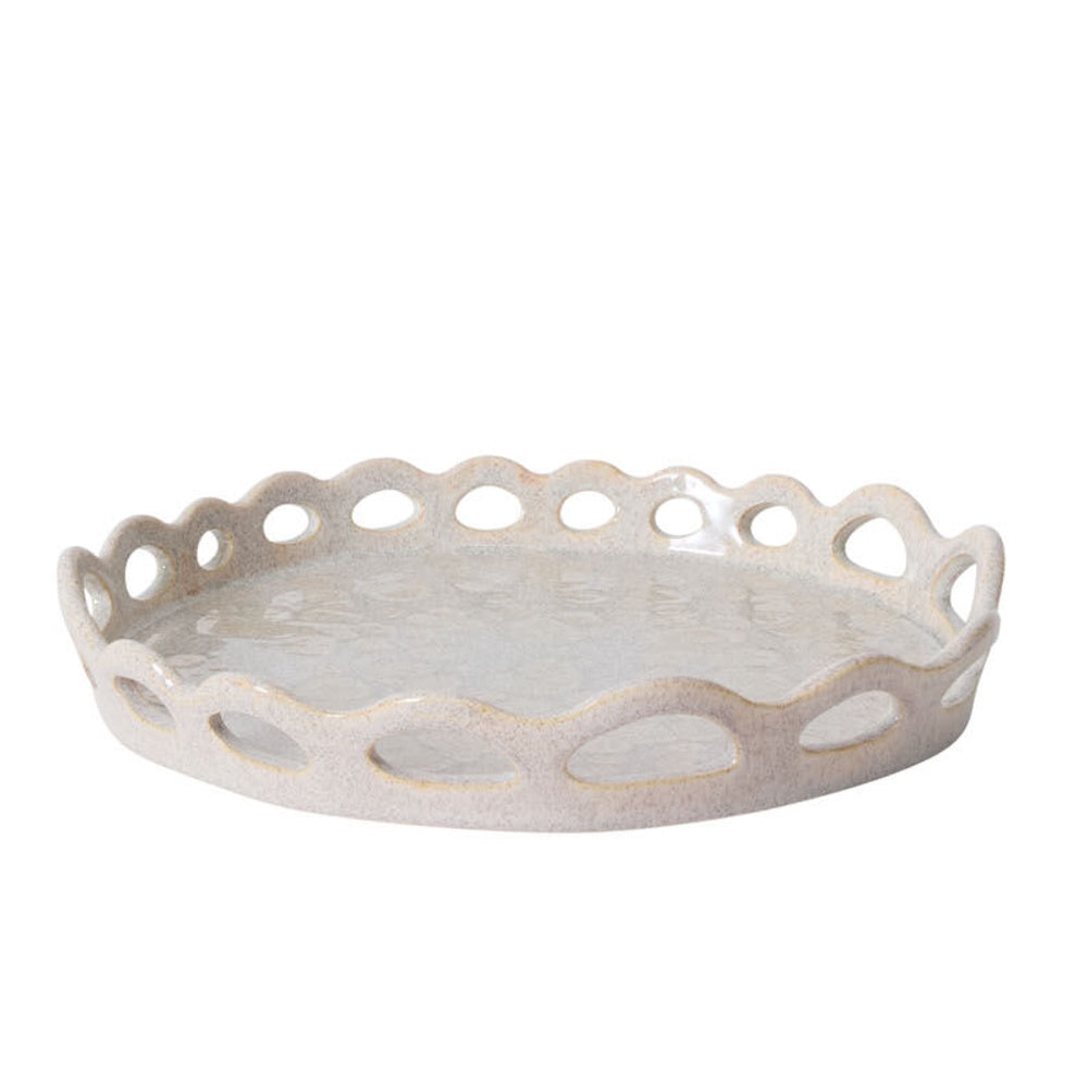 Round, speckled ceramic tray with a glossy finish and a scalloped, cutout border against a white background.