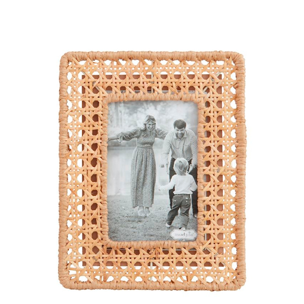 Woven cane picture frame featuring a natural tan rattan texture and a black-and-white family photo inside.