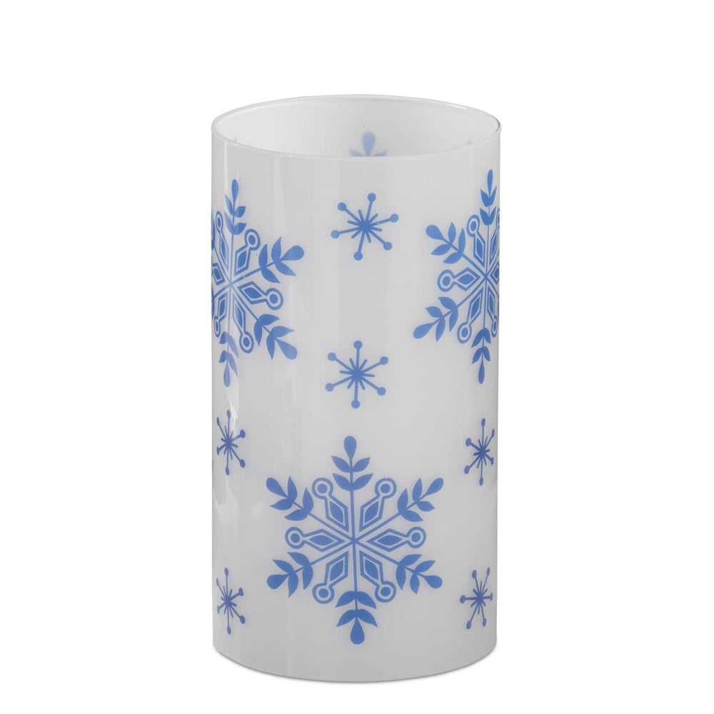 White candle slip cover featuring blue snowflakes.