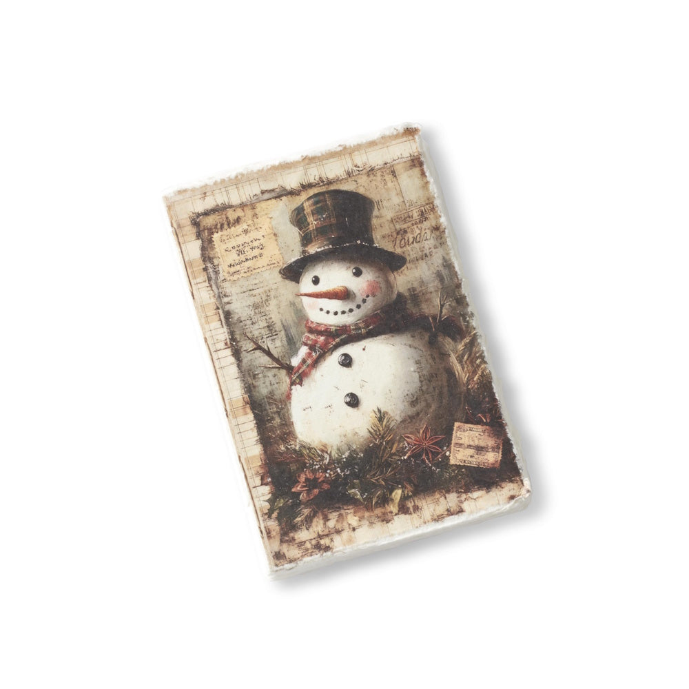 A soft-cover Christmas journal featuring a vintage snowman illustration in a top hat with a deckle edge.