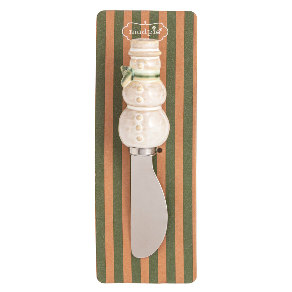 White snowman Christmas spreader with a green scarf on striped packaging.