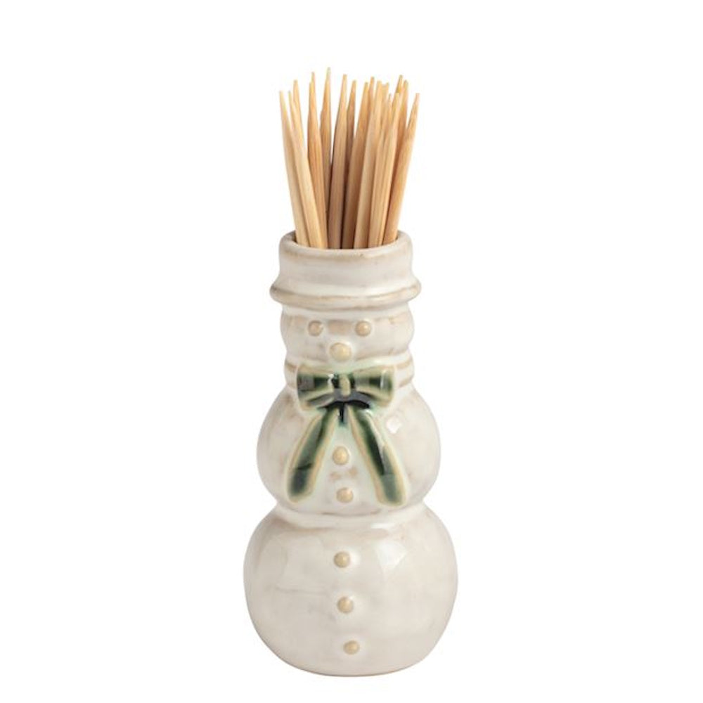 White ceramic snowman toothpick holder filled with wooden toothpicks.