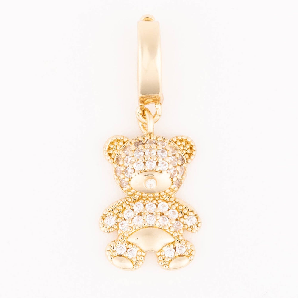 Gold teddy bear charm paved with clear sparkling crystals hanging from a smooth bail.