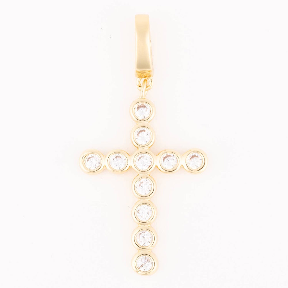 Gold cross charm featuring round bezel-set clear crystals hanging from a smooth bail.
