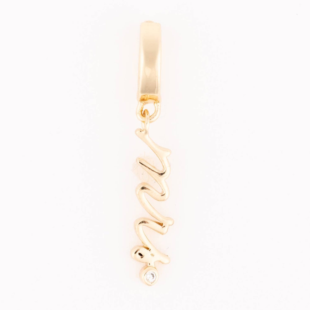 Gold "Mrs" script charm with a tiny bezel-set crystal dot hanging from a smooth bail.