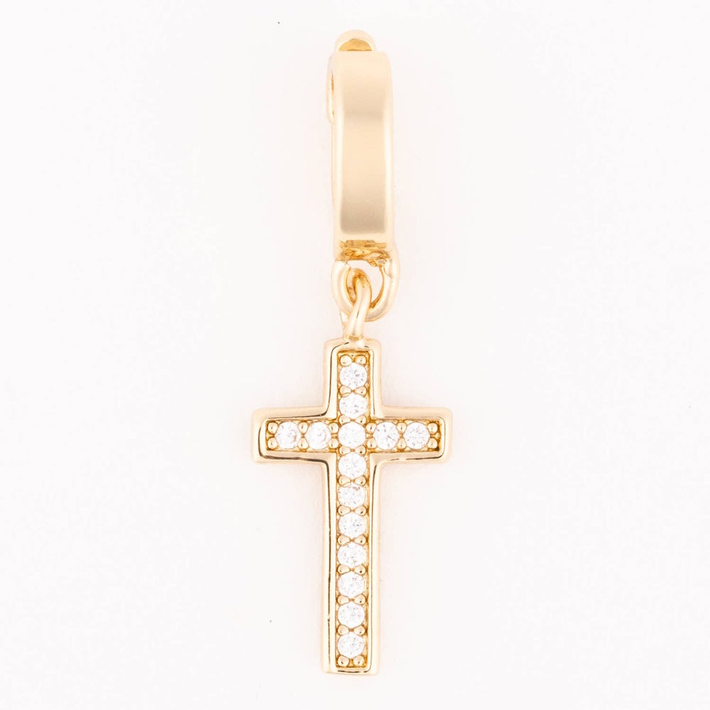 Gold cross charm with pavé-set clear crystals hanging from a smooth bail.