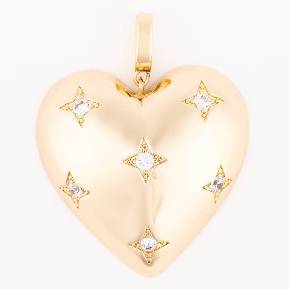 Gold heart pendant charm featuring starburst engravings set with clear crystals.