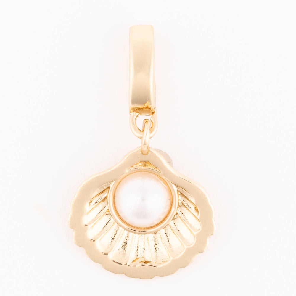 Gold seashell charm featuring a round central pearl hanging from a smooth bail.