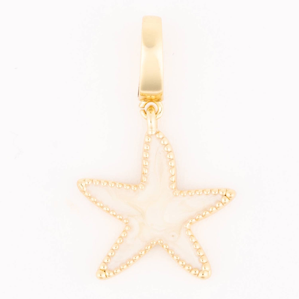 Gold starfish charm with pearlescent white enamel inlay and beaded trim hanging from a smooth bail.