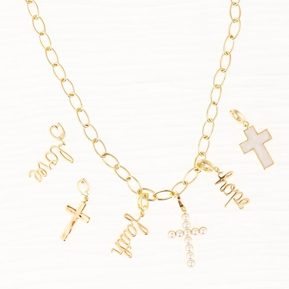 Gold link chain necklace with cross, faith, and hope charms, surrounded by love and additional cross charms.