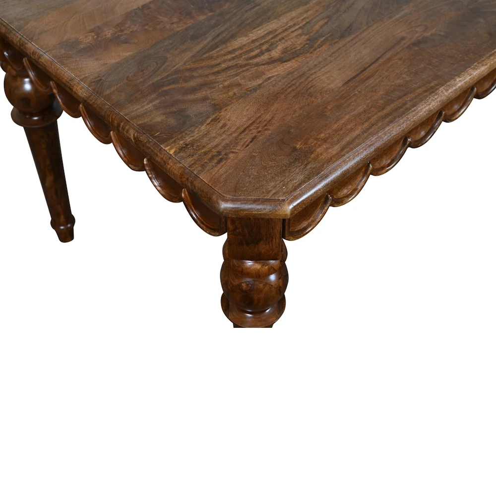 Handcrafted dark walnut wood coffee table with scalloped edge detail and carved turned legs.