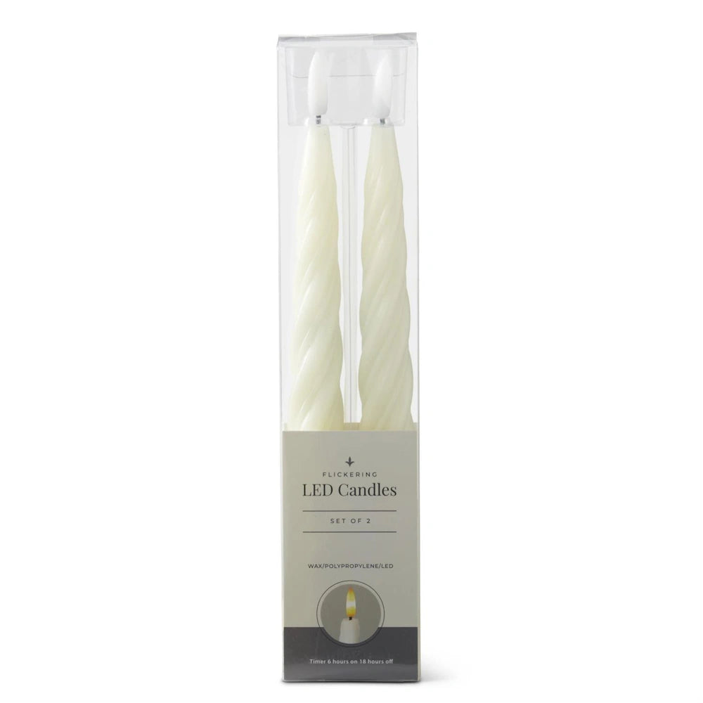 A packaged set of two white spiral LED taper candles in a clear plastic box with a grey base.