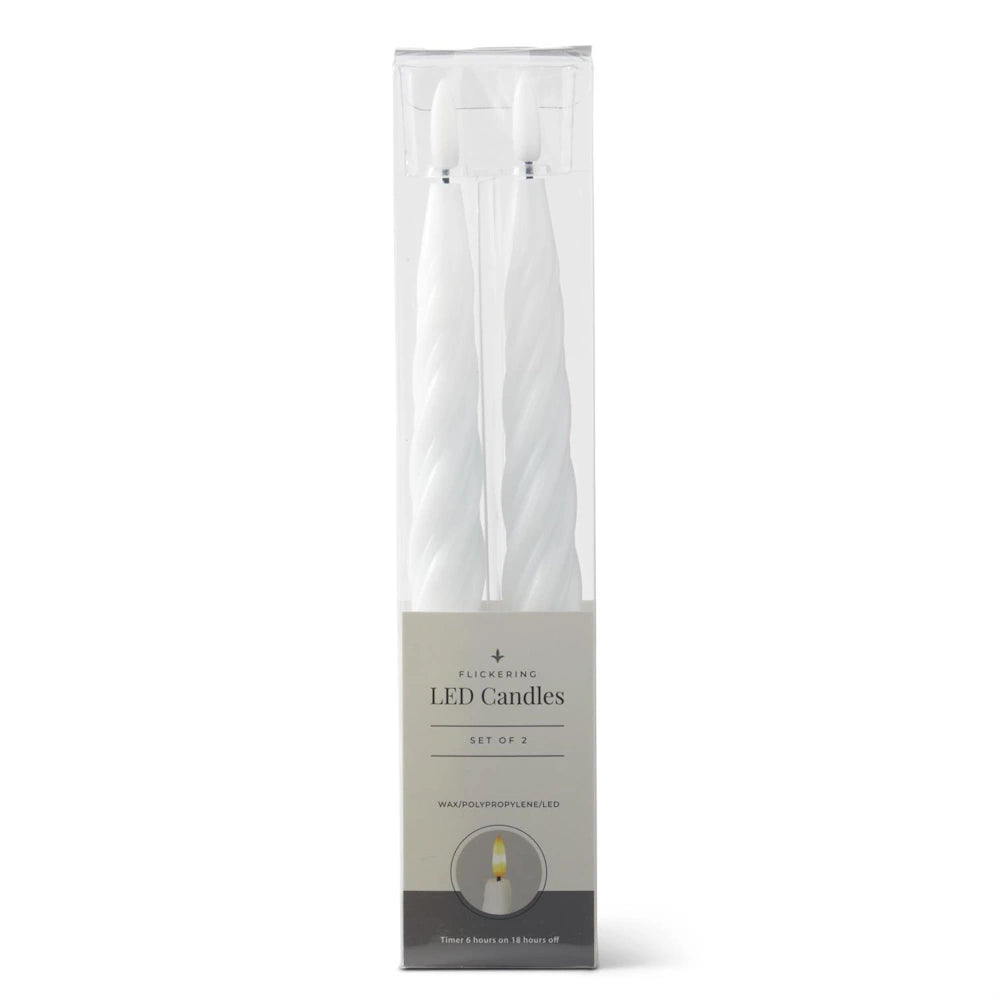 A packaged set of two white spiral LED taper candles in a clear box with a grey label.