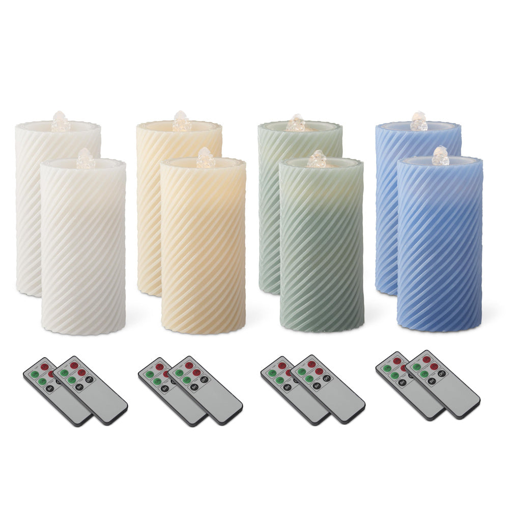 Spiral LED wax pillar water candles in white, cream, green, and blue with remote controls and timers.