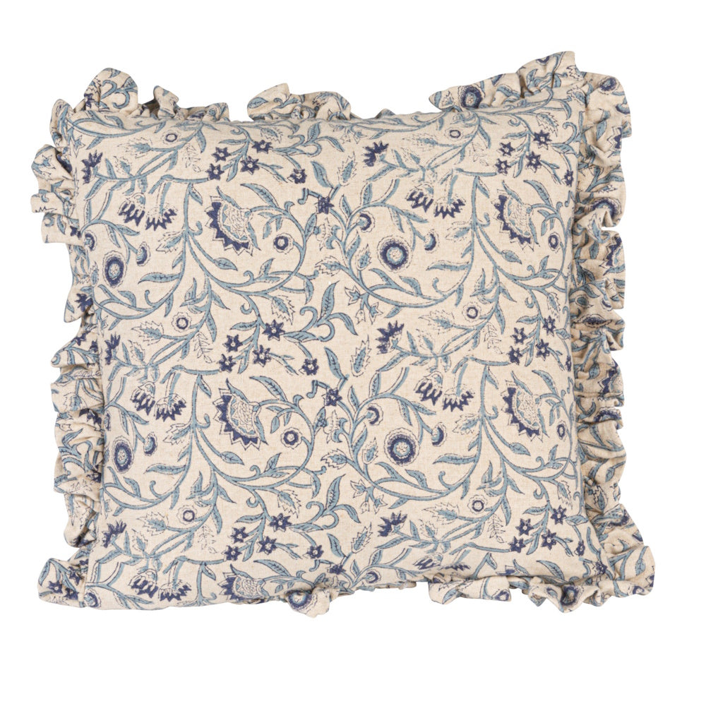 Square, beige cotton pillow featuring a blue floral block-print pattern and ruffled edges on a white background.