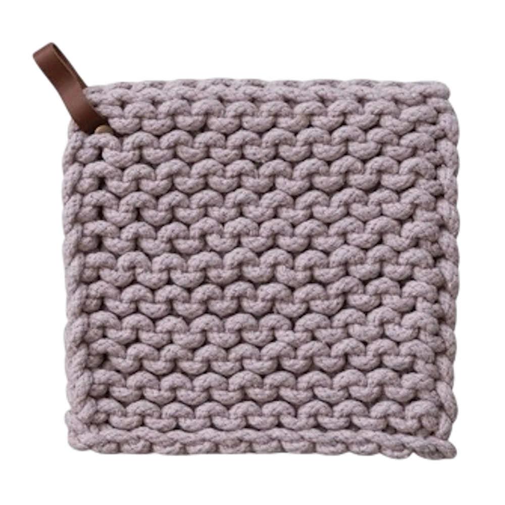 Handwoven violet cotton crochet pot holder with a brown leather hanging loop for rustic kitchen decor and heat safety.