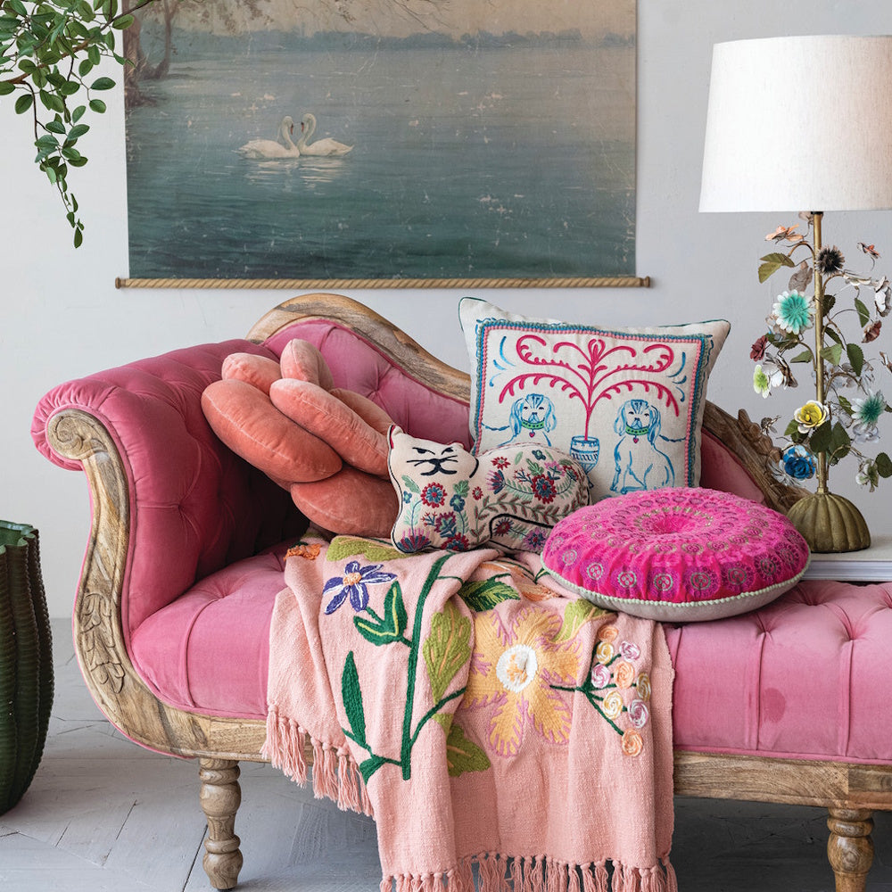 Square cotton linen pillow with embroidered Staffordshire dog scene on a pink velvet chaise lounge.