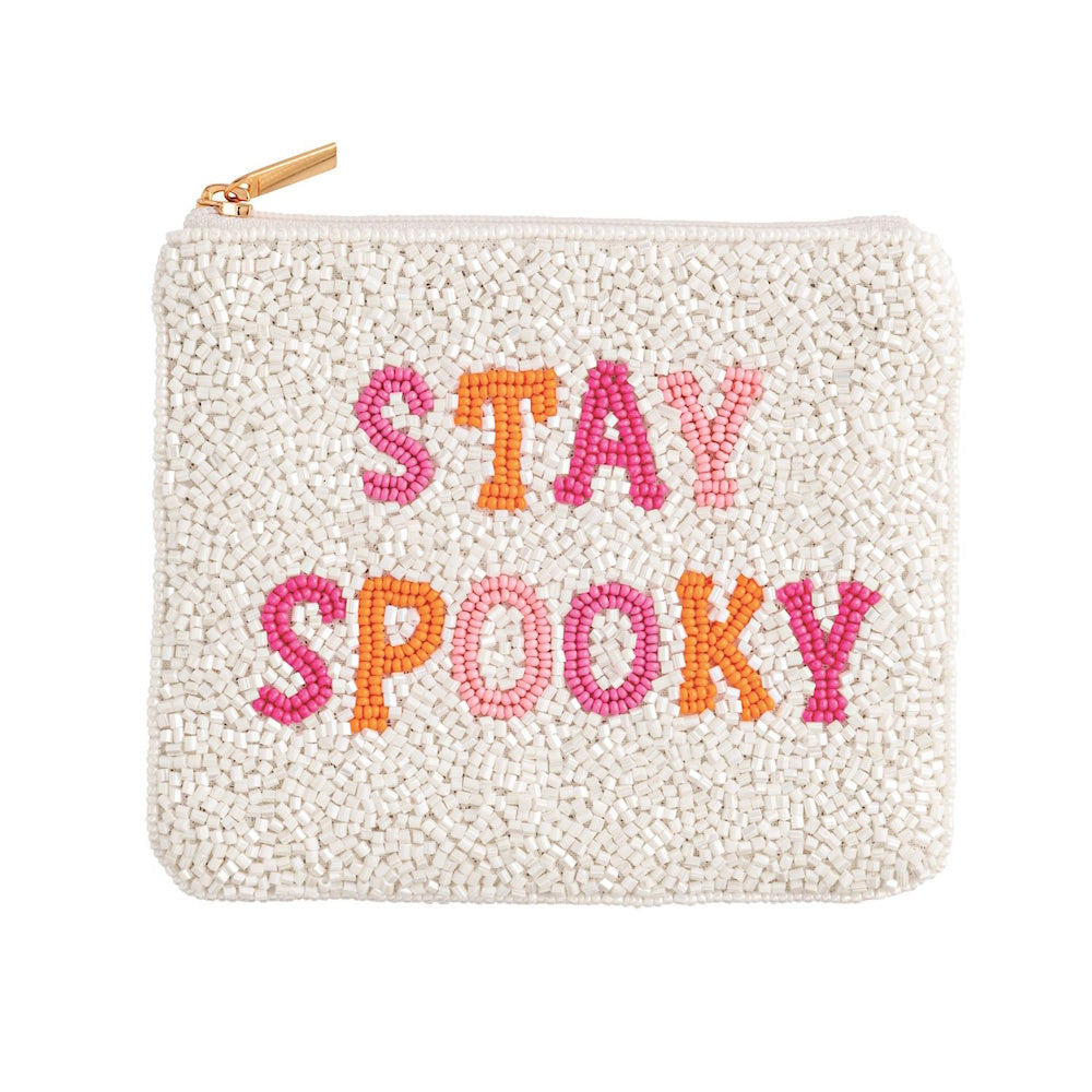 White beaded pouch with a gold zipper, featuring the words "STAY SPOOKY" in pink and orange beads.