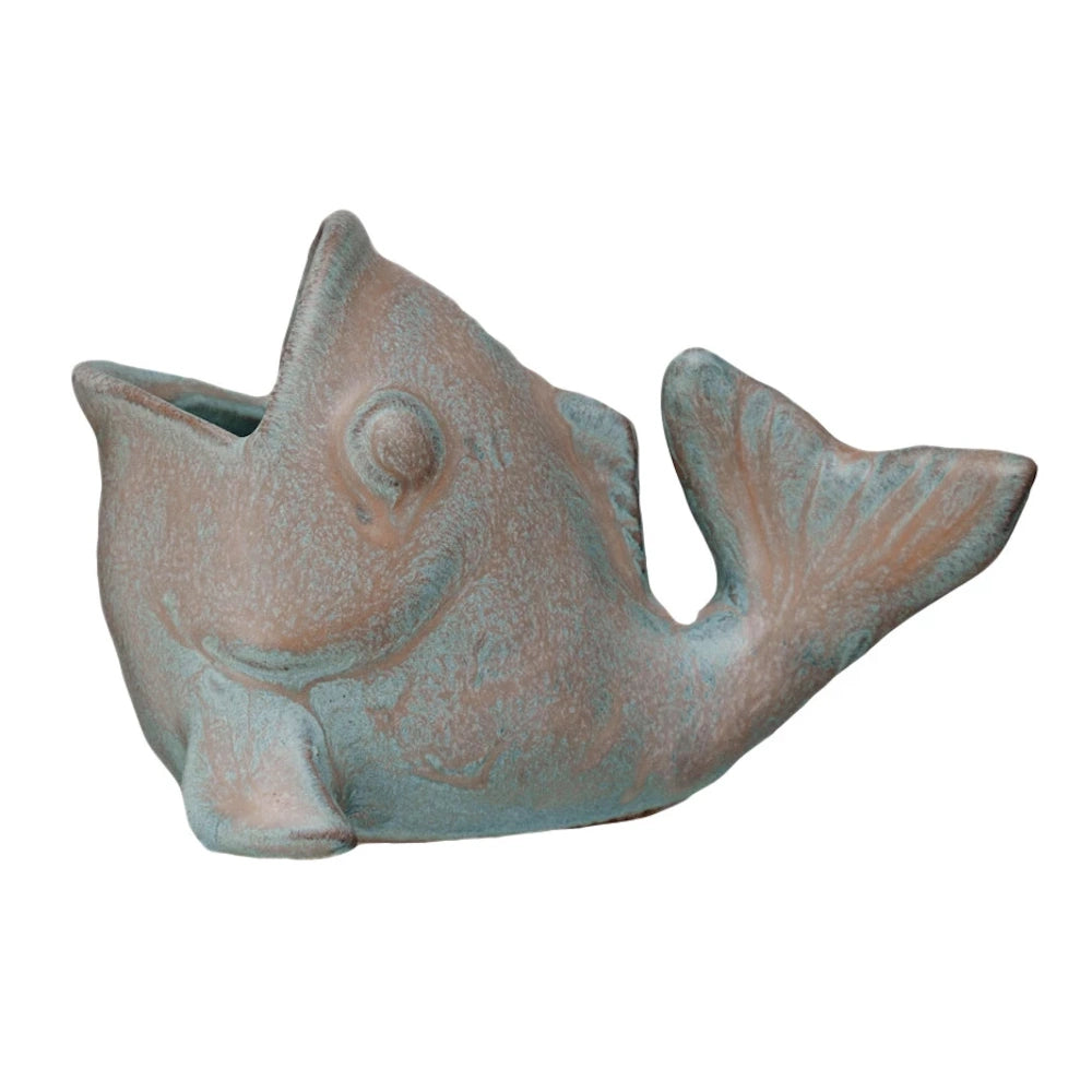Rustic teal and copper fish-shaped ceramic planter with open mouth design.
