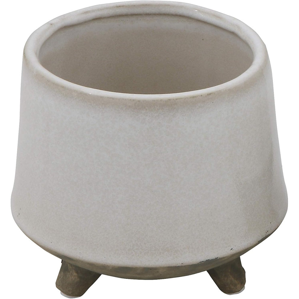 Minimalist off-white stoneware flower pot with three feet, featuring a matte ceramic glaze for modern home decor.