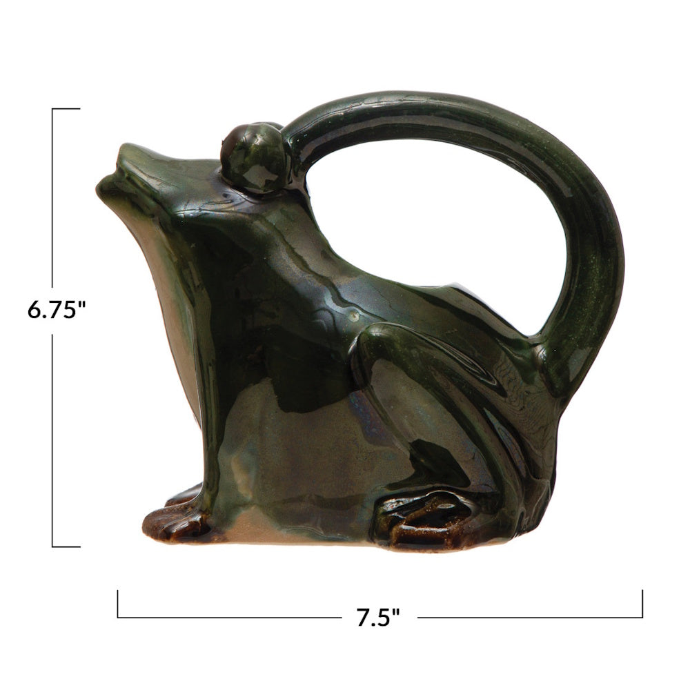 A dark green frog-shaped ceramic watering pitcher with dimension lines showing 6.75 inches high and 7.5 inches long.