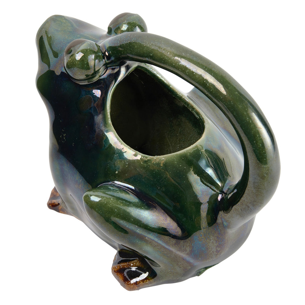Top-down view of a glossy dark green ceramic frog pitcher with a wide opening and a curved back handle.