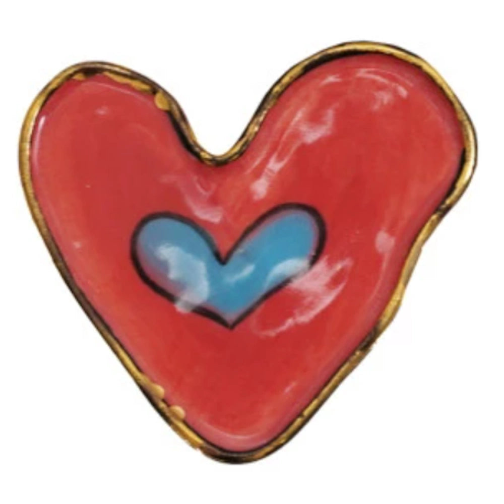 A simple graphic of a heart inside a larger red heart with a gold outline.