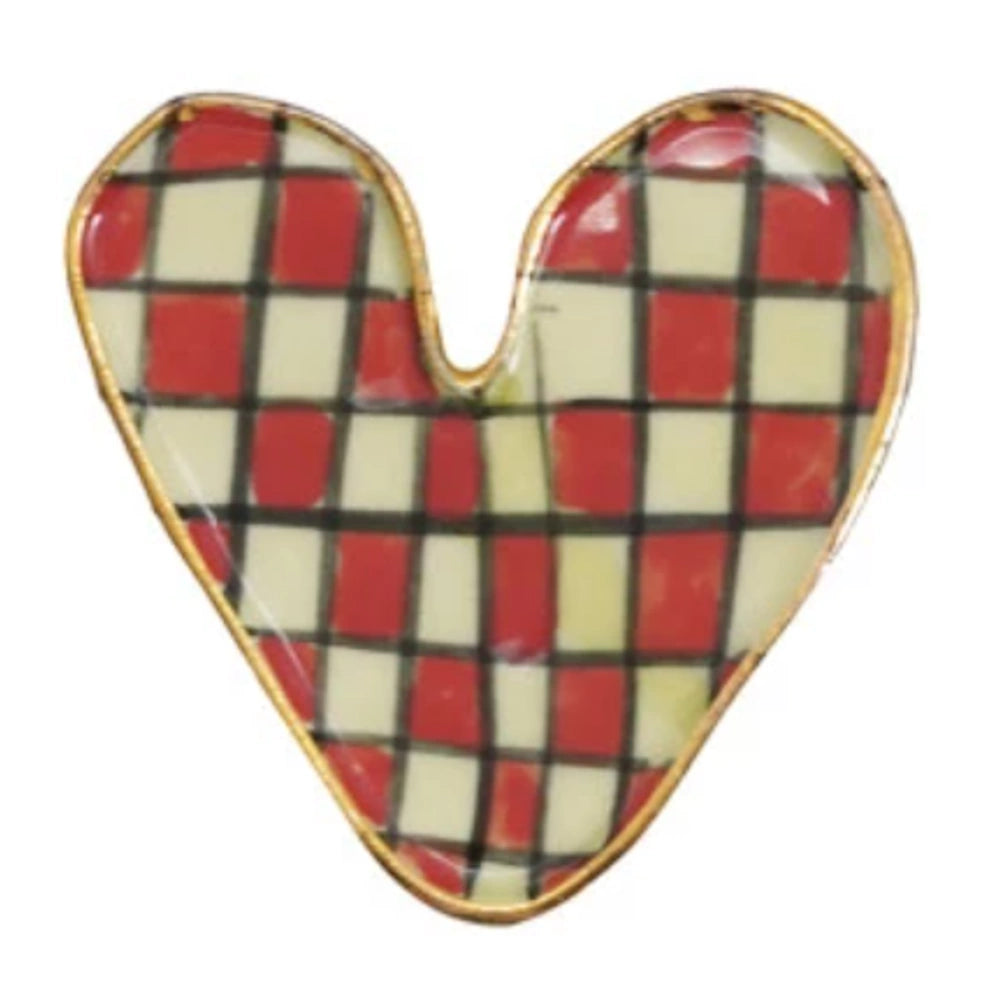 Checkered heart-shaped trinket dish with red, cream, and black squares and a gold rim.