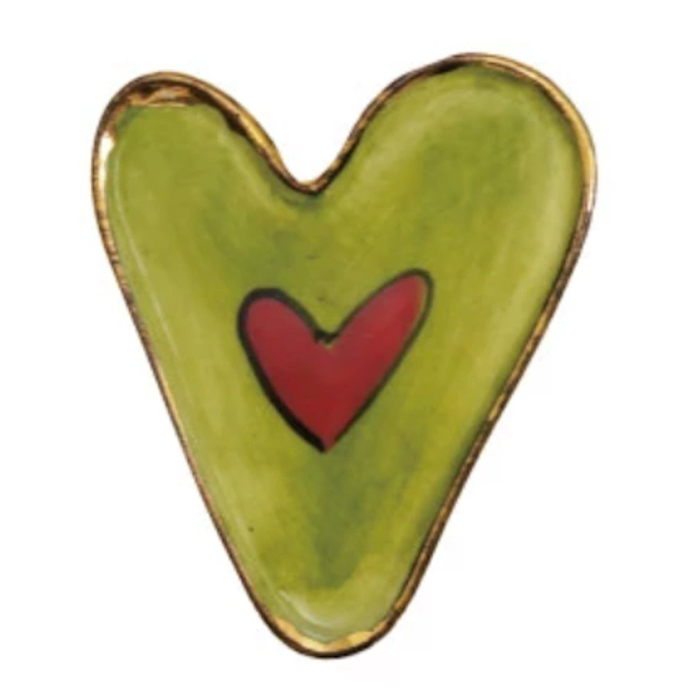 Green heart-shaped stoneware magnet with a smaller red heart in the center and a gold-toned metallic rim.