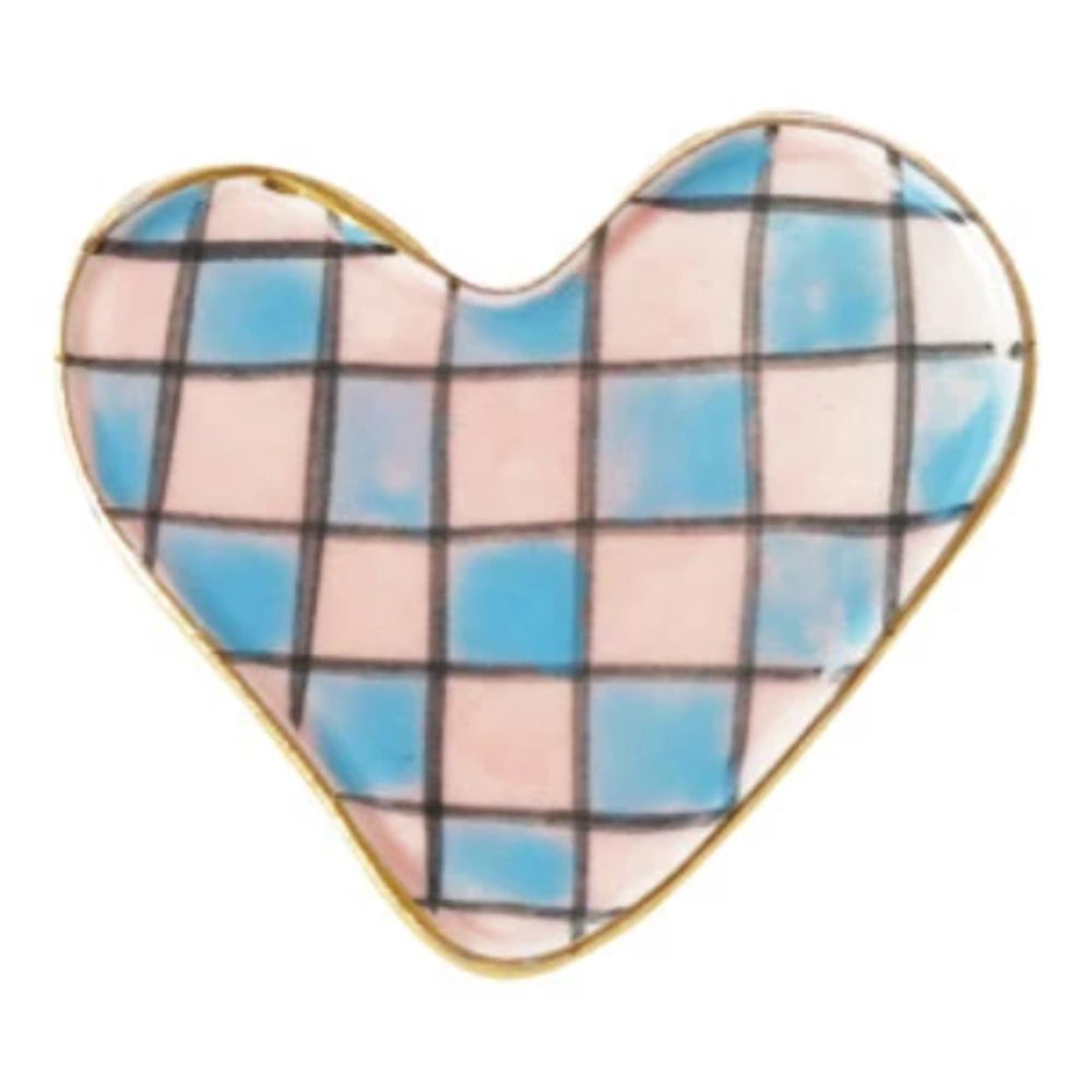 Stoneware heart-shaped magnet with a pink and blue checkered pattern and gold trim on a white background.