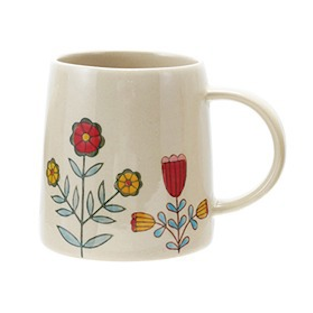 Cream stoneware mug featuring colorful hand-painted folk art flowers in red and yellow with blue leaves.