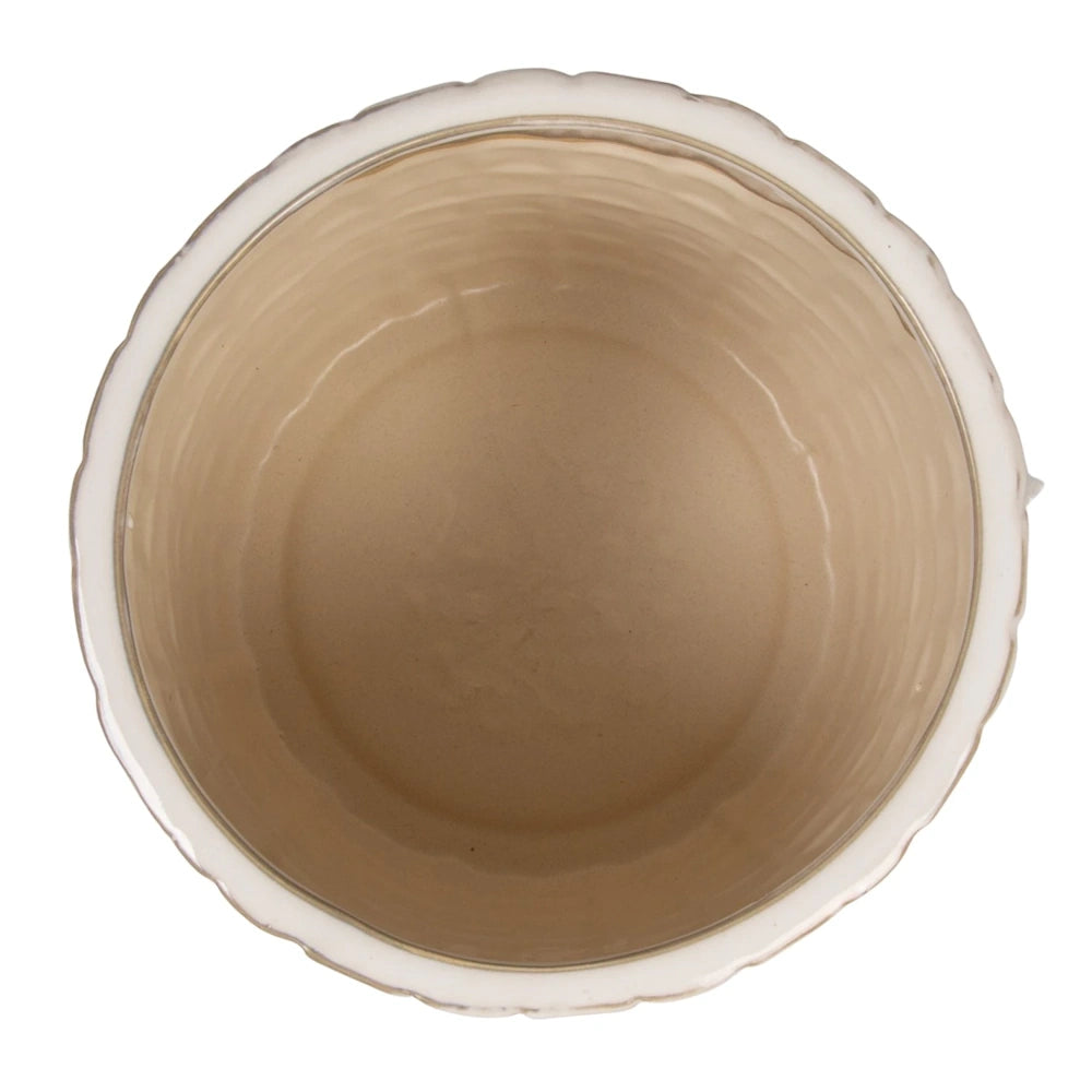 Empty cream-colored textured ceramic plant pot with scalloped rim, aerial view.