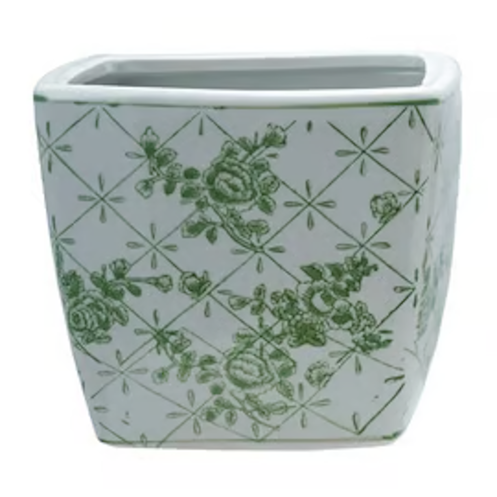 White ceramic square planter with a green floral rose pattern and diamond lattice design on a plain background.