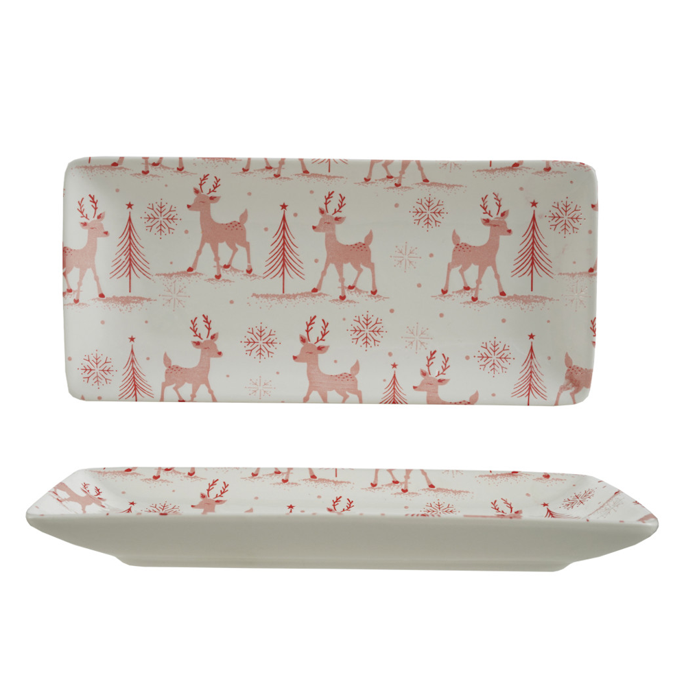 Rectangular stoneware platter featuring a red holiday pattern of reindeer, trees, and snowflakes.