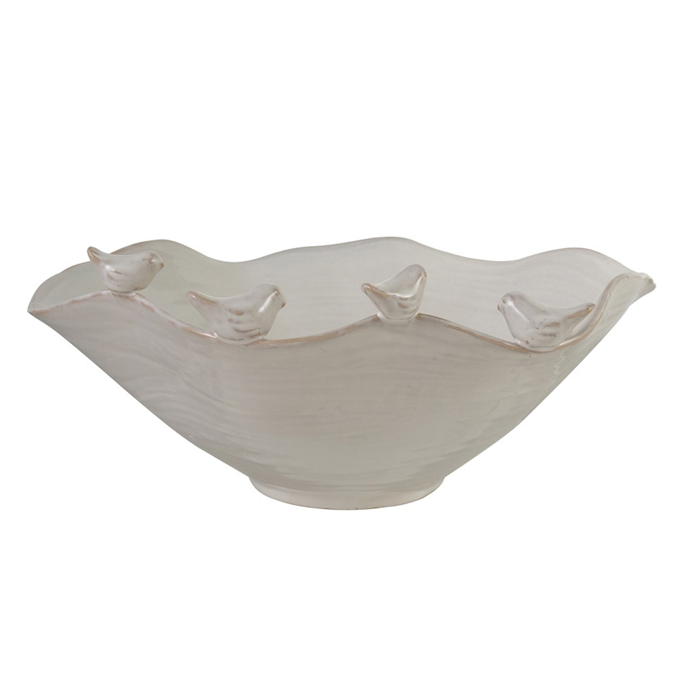 Off-white stoneware ruffled bowl with small decorative birds perched along the wavy rim.