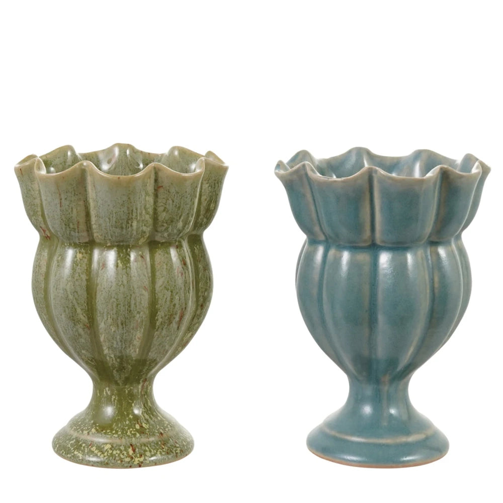Pair of glazed ceramic footed vases in mottled green and soft blue, featuring scalloped rims and ribbed bodies.