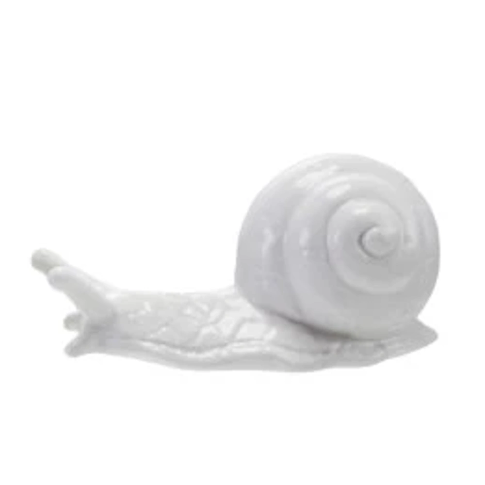 White ceramic snail figurine with a coiled shell on a white background for home decor.