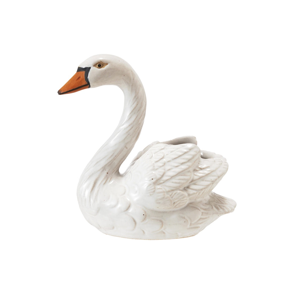 White stoneware swan-shaped toothpick holder with detailed carved wings and an orange-and-black beak.