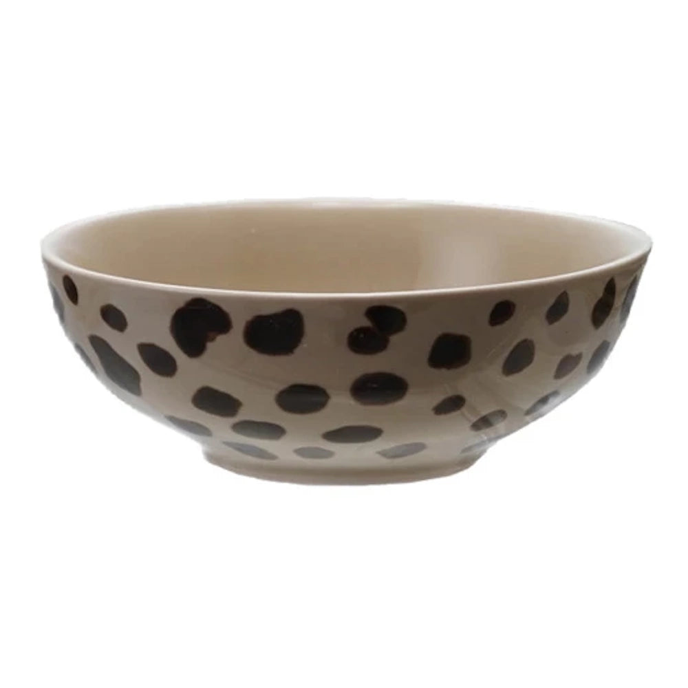 Minimalist spotted animal print cereal bowl, neutral cream and black decorative porcelain dish for home dining.