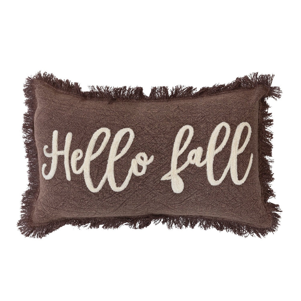 Brown fringed lumbar pillow with white tufted cursive text that reads "Hello fall".