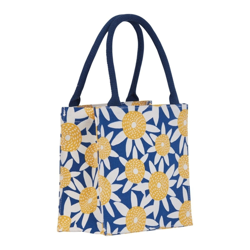 Blue tote bag with a white and yellow sunflower pattern and dark blue handles.